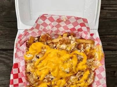Loaded fresh-cut fries with melted cheese and chicken