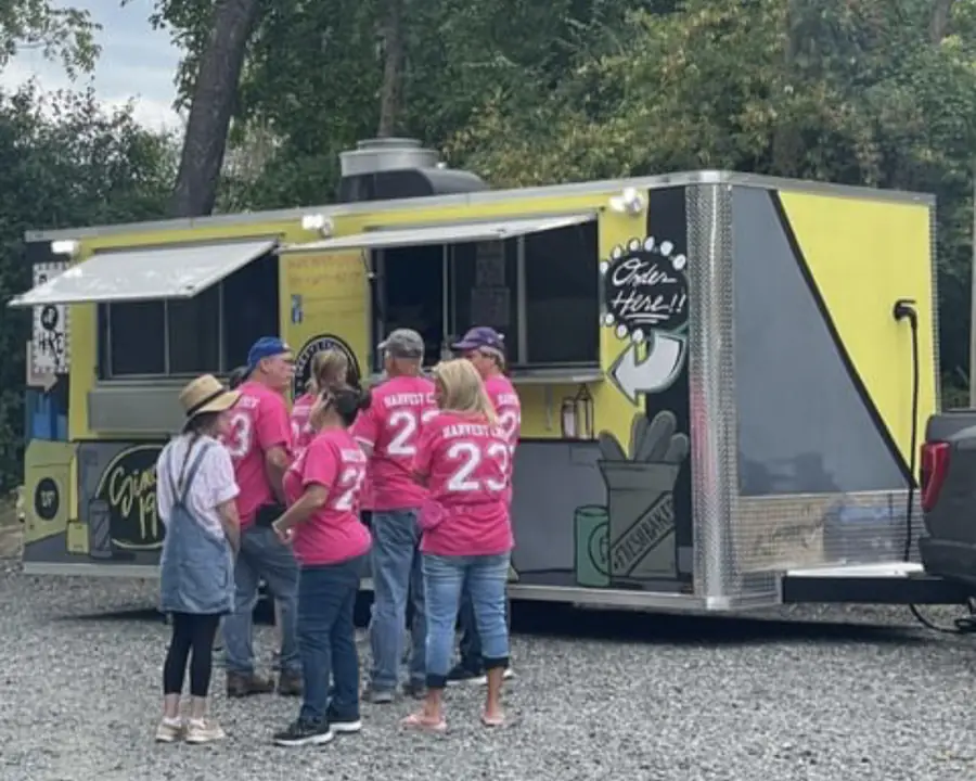 A group lined up at the Deezy's Famous food truck