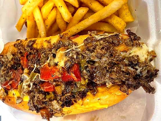 Fresh-cut fries served next to a Deezy's cheesesteak